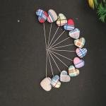 Multicoloured heart shape pins