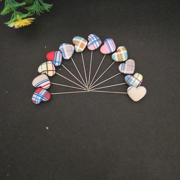 Multicoloured heart shape pins