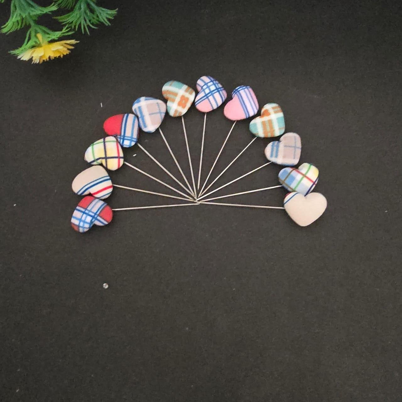 Multicoloured heart shape pins